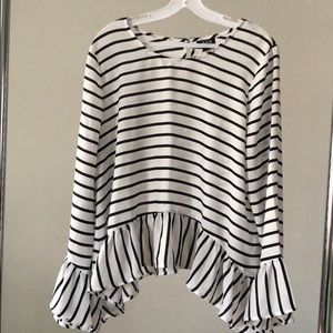 Long sleeve ruffle blouse.